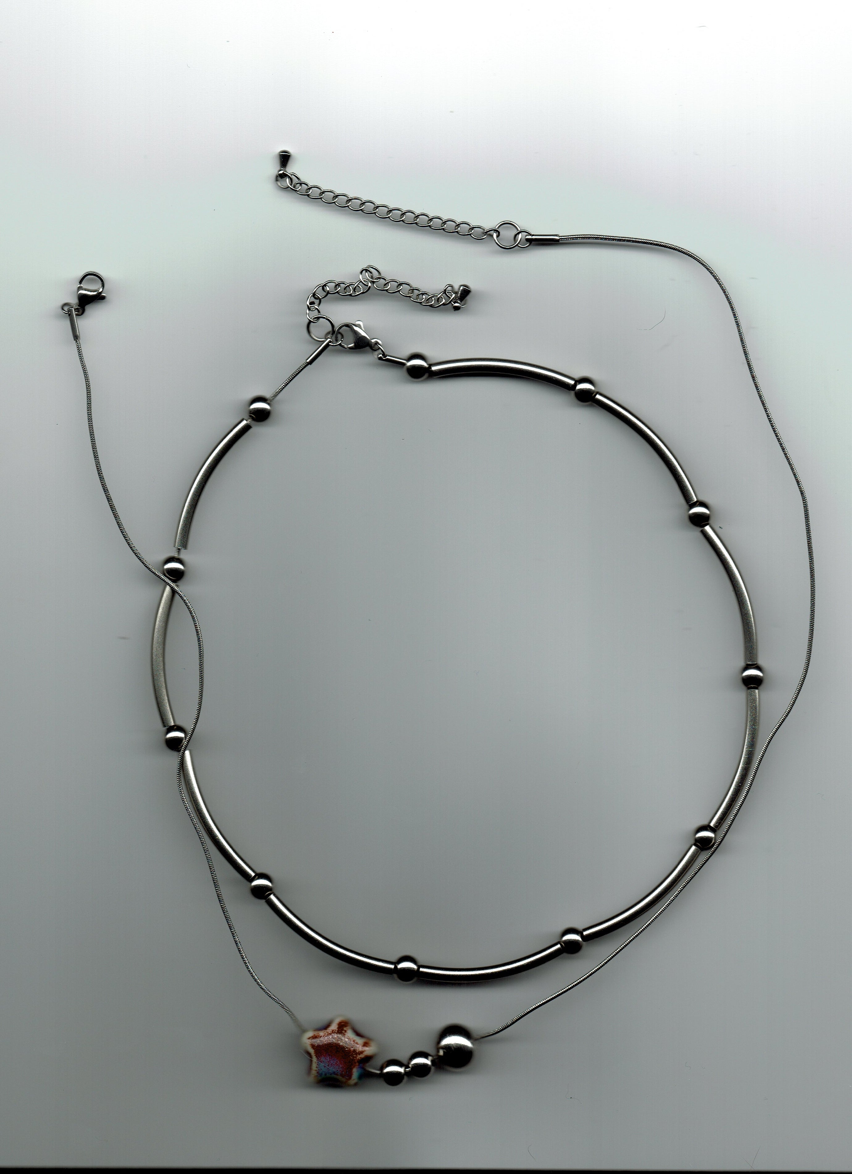 stainless steel necklaces on a white background