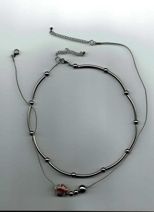 stainless steel necklaces on a white background